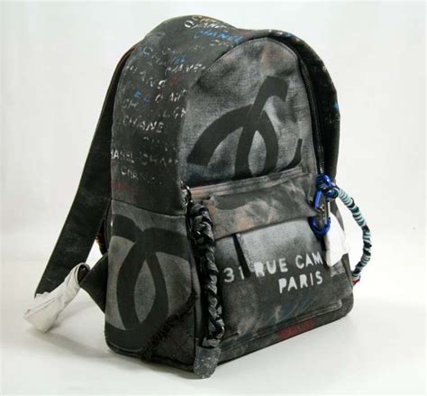 chanel small black graffiti art school backpack|Chanel graffiti suits.